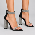 Black rhinestone heels on a model